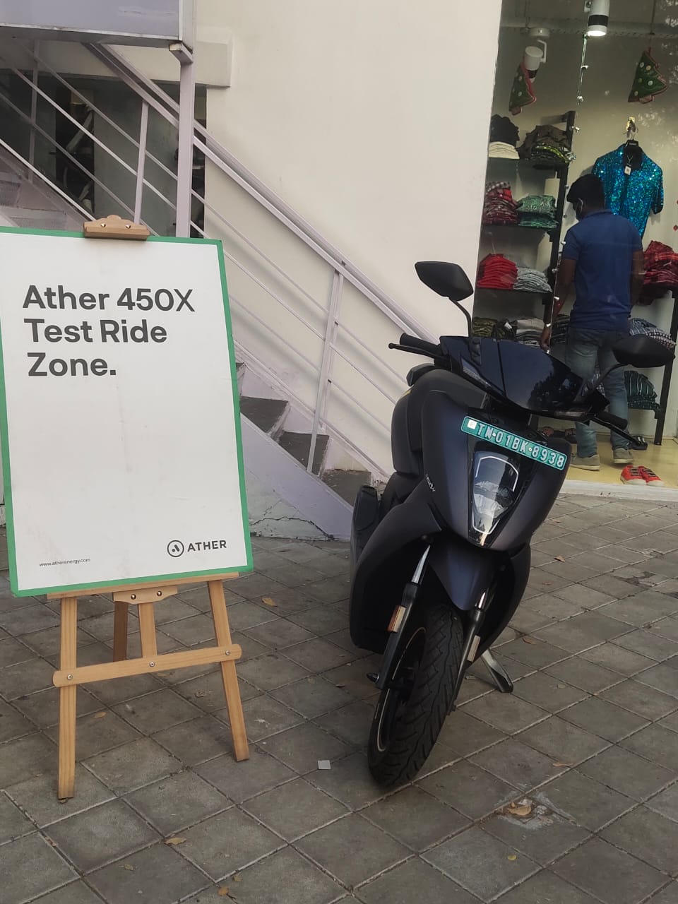 Ather Energy electric scooter advertisement on Chai Kings tea cups