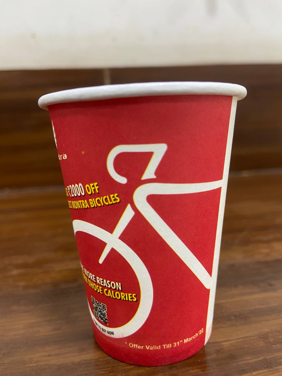 TI Cycles advertisement printed on Chai Kings paper cups