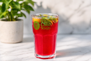 Glass of Cranberry Mojito at Chai Kings with fresh mint and lemon